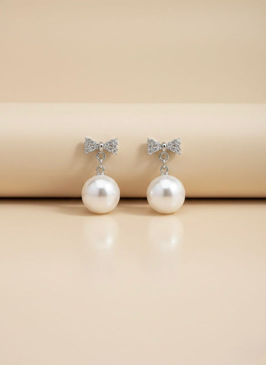 Shimmering Bow Pearl Drop Earrings